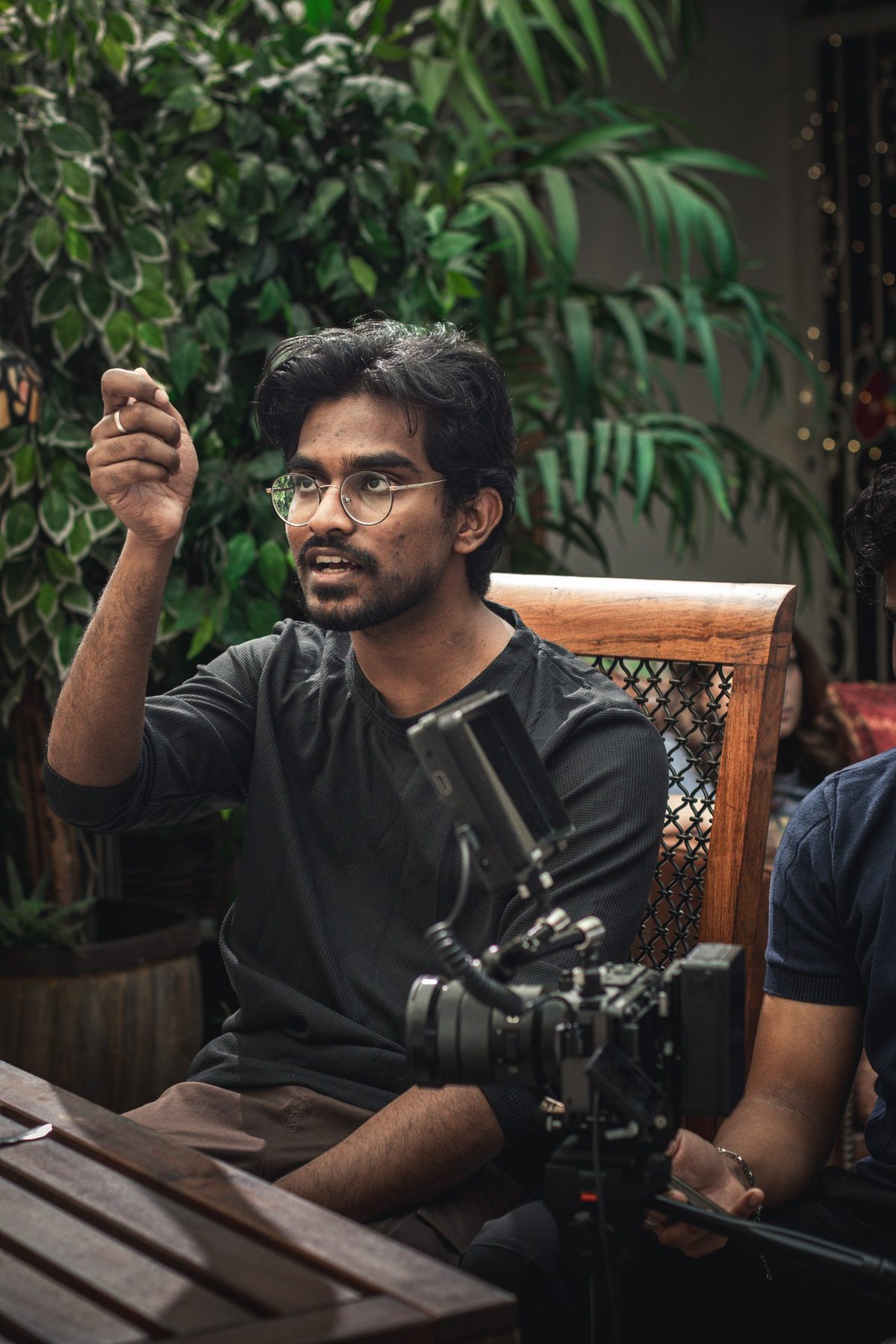 A director gestures while explaining a shot