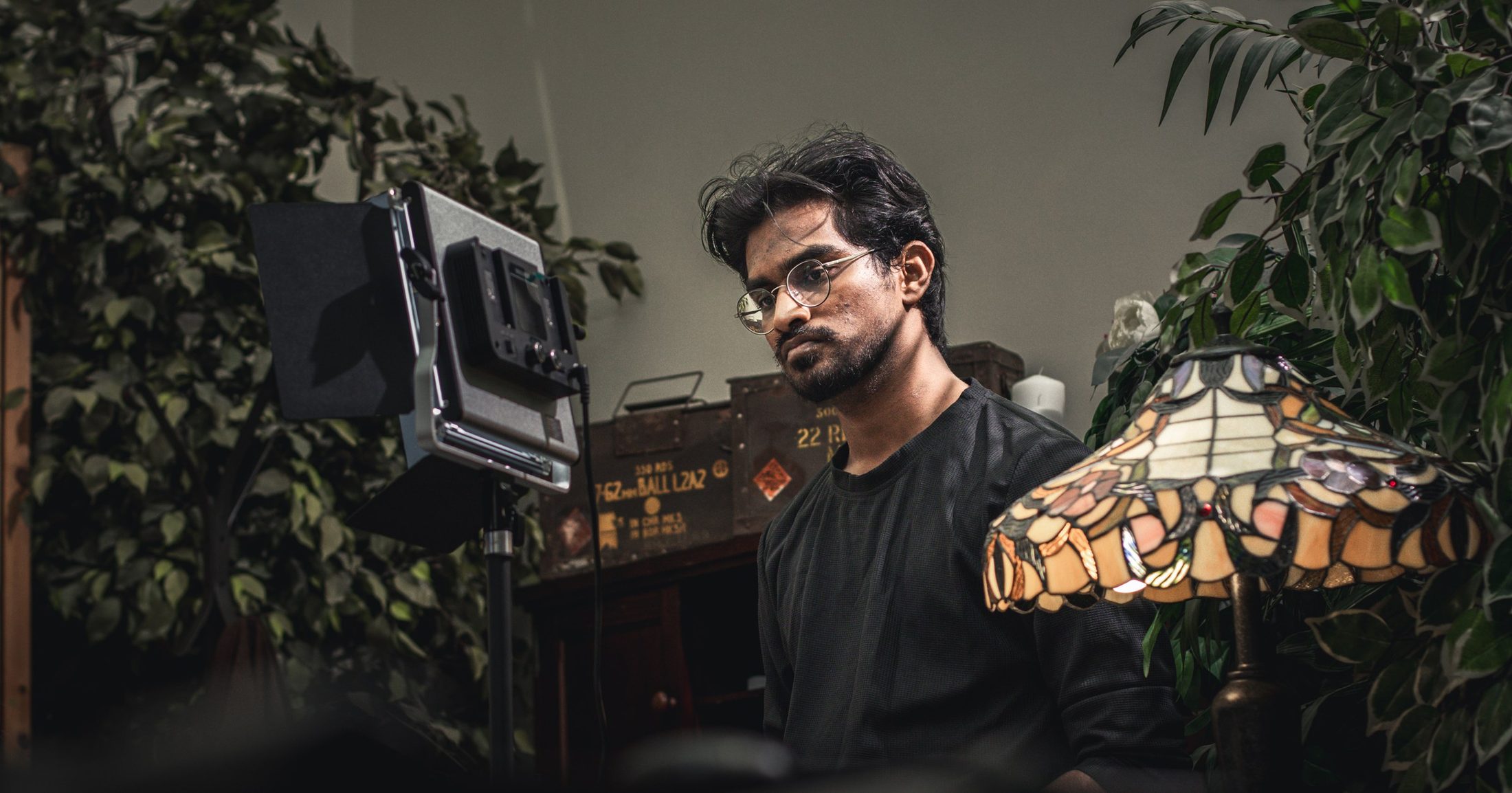 A cinematographer checks a light on the Szerelem teaser set